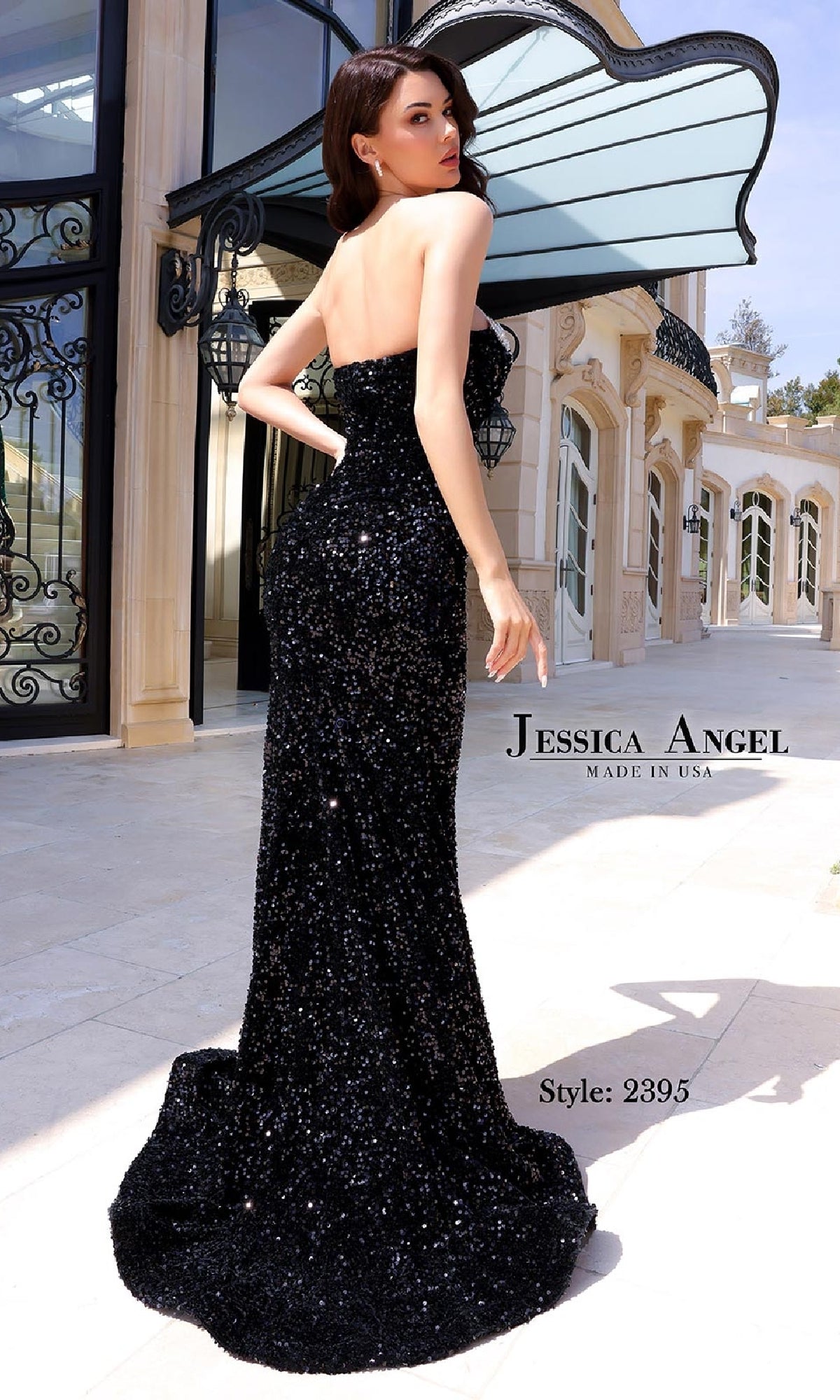 A woman stands outside a modern, elegant building wearing the Beaded-Neck Long Prom Dress: Jessica Angel 2395, a glamorous sequin gown.